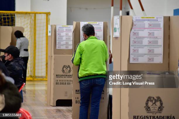 People vote during the 2022 Congressional elections in Colombia, on March 13 in Pasto, Colombia. Colombia is set to elect congress on March 13 and...