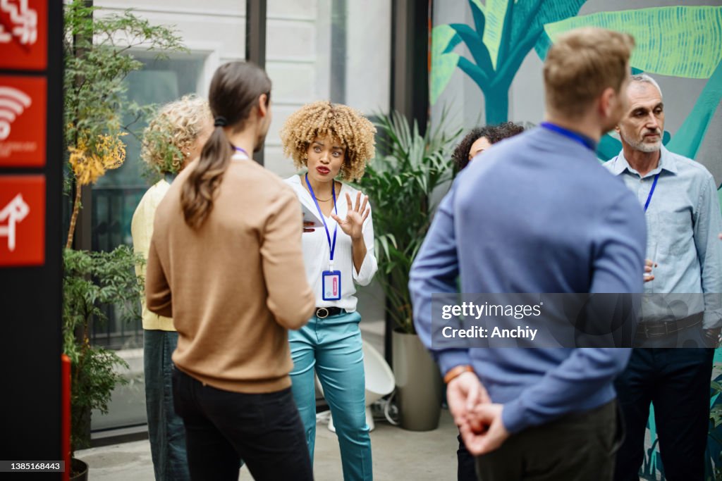 Multiethnic business people talk during a coffee break
