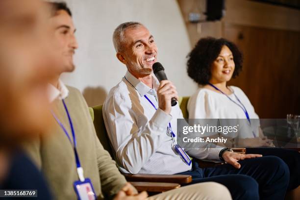 a panel of experts participate in a q&a breakout session during a business conference. - panelist stock pictures, royalty-free photos & images