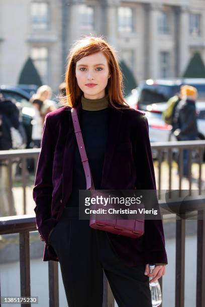 Model with red hair is seen outside Chanel during Paris Fashion Week - Womenswear F/W 2022-2023 on March 08, 2022 in Paris, France.