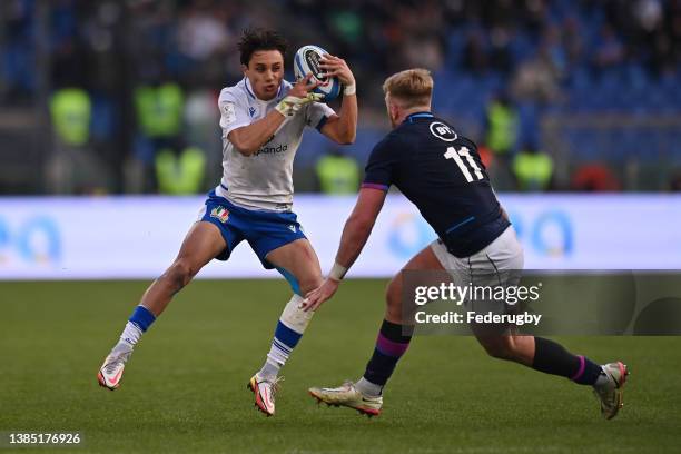 Ange Capuozzo of Italy in action against Kyle Steyn of Scotland during the Guinness Six Nations Rugby match between Italy and Scotland at Stadio...