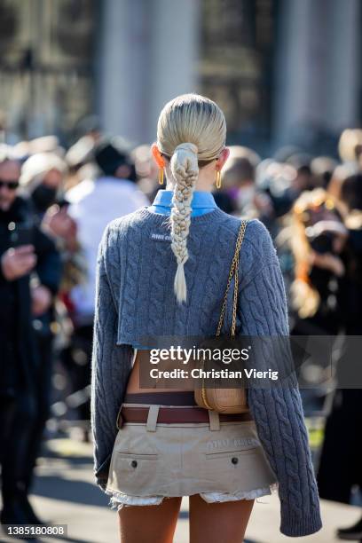 Caroline Caro Daur seen with pigtail wearing cropped blue button shirt, knit, mini skirt in beige, bag, knee high socks, loafers outside Miu Miu...