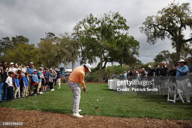 Anirban Lahiri of India plays a second shot on the eighth hole as a gallery of fans look on during the final round of THE PLAYERS Championship on the...
