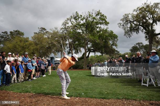 Anirban Lahiri of India plays a second shot on the eighth hole as a gallery of fans look on during the final round of THE PLAYERS Championship on the...