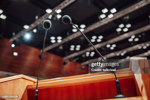 microphones on a lectern in a conference rooms - germany training and press conference stock pictures, royalty-free photos & images