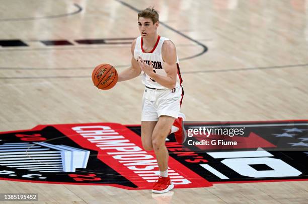 Grant Huffman of the Davidson Wildcats handles the ball against the Richmond Spiders in the Championship game of the Atlantic 10 Men's Basketball...