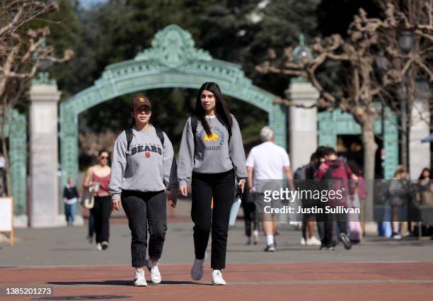 Students wear UC Berkeley school apparel as they walk through Sproul Plaza on the UC Berkeley campus on March 14, 2022 in Berkeley, California. UC...