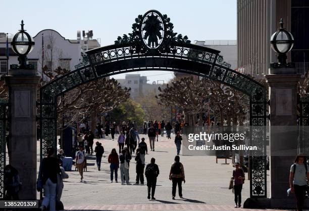 People walk through Sproul Plaza on the UC Berkeley campus on March 14, 2022 in Berkeley, California. UC Berkeley is set to cut on-campus enrollment...