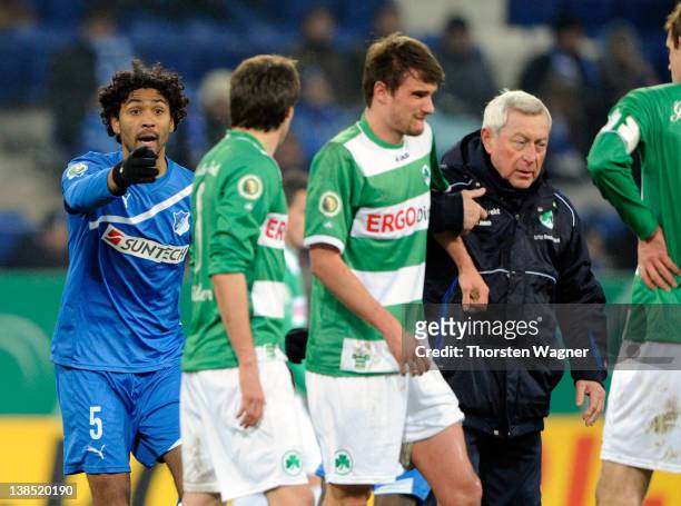 Marvin Comper of Hoffenheim is shown the red card by referee Marco Fritz after a foul against Christopher Noethe of Fuerth during the DFB Cup Quarter...