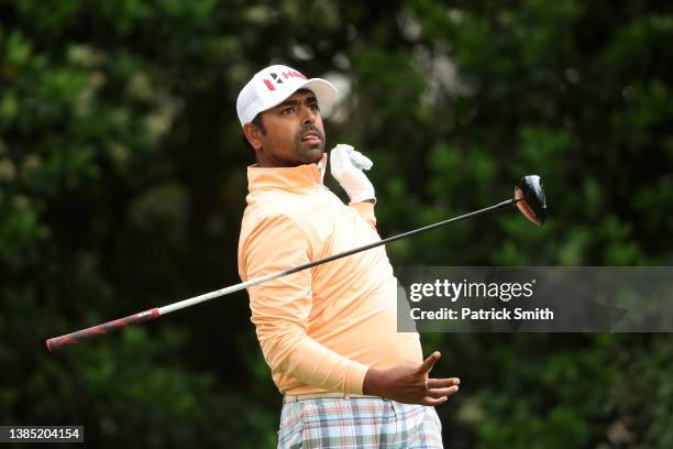 Anirban Lahiri of India lets go of his club as he hits his shot from the 11th tee during the final round of THE PLAYERS Championship on the Stadium...