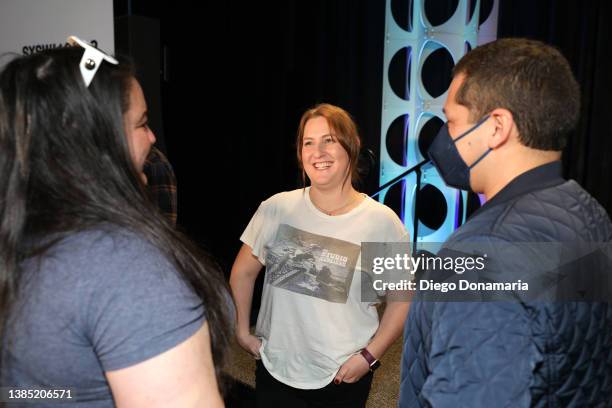 Nancy Jundi and Melissa Brown Mccoy speak to an attendee at Ted Lasso Strikes Back during the 2022 SXSW Conference and Festivals at Austin Convention...
