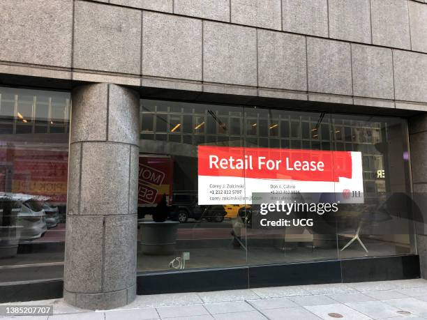 Retail for Lease sign in storefront window, midtown, Manhattan, New York.