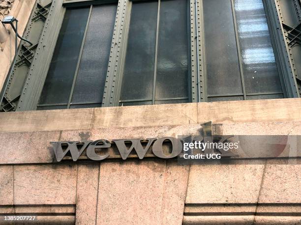 Wework sign on building, 45th street near Lexington Avenue, Manhattan, New York.