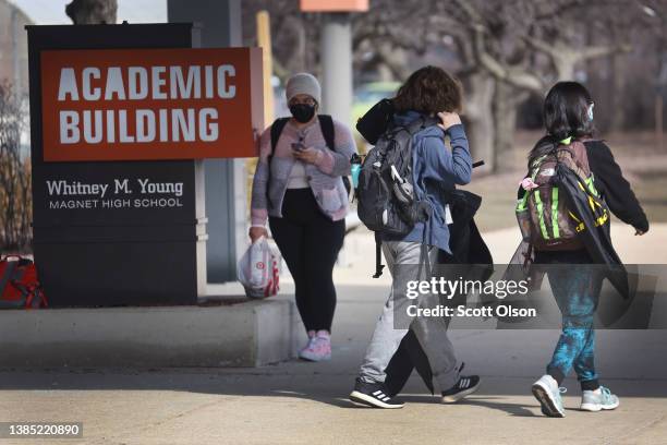 Students leave Whitney Young Magnet High School at the end of the school day on March 14, 2022 in Chicago, Illinois. As COVID-19 cases continue to...