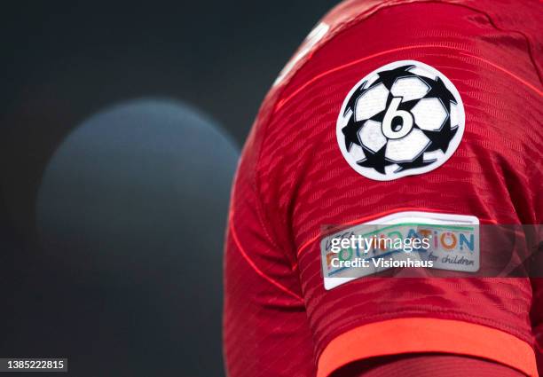 The UEFA Champions League logo displaying the six times Liverpool have been winners alongside the UEFA Foundation badge on a shirt sleeve during the...