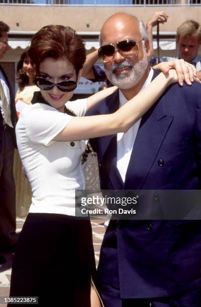 French Canadian singer and businesswoman, Celine Dion, hugs her husband Canadian musical producer, talent manager and singer, Rene Angelil , pose for...