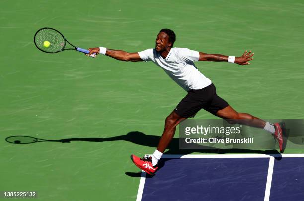 Gael Monfils of France plays a forehand against Daniil Medvedev of Russia in their third round match on Day 8 of the BNP Paribas Open at the Indian...