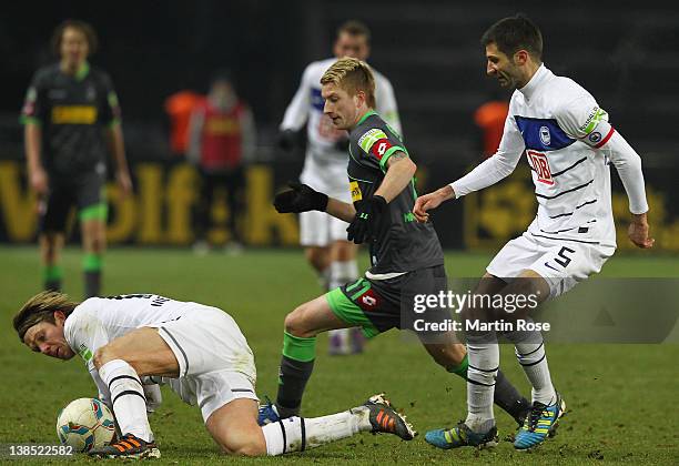 Peter Niemeyer of Berlin and Marco Reus of Moenchengladbach battle for the ball during the DFB Cup Quarter Final match between Hertha BSC Berlin and...