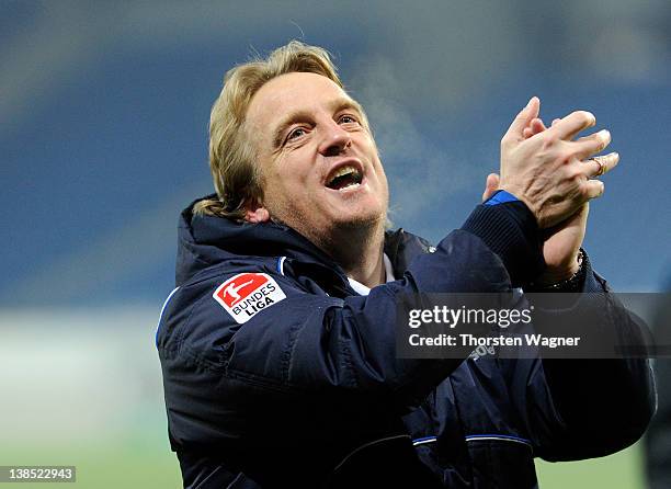 Head coach Mike Bueskens of Fuerth celebrates with the fans after winning the DFB Cup Quarter Final match between TSG 1899 Hoffenheim and SpVgg...