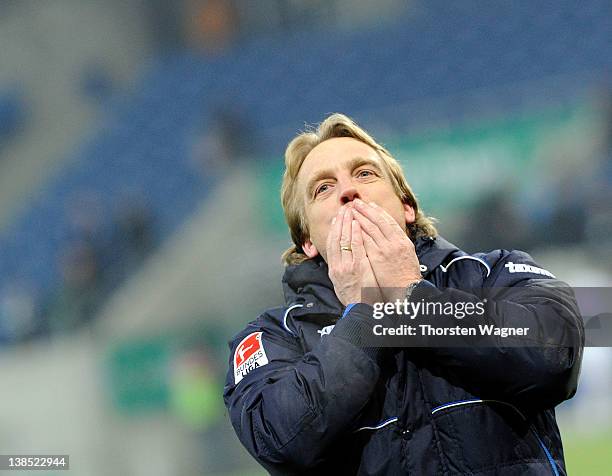 Head coach Mike Bueskens of Fuerth celebrates with the fans after winning the DFB Cup Quarter Final match between TSG 1899 Hoffenheim and SpVgg...