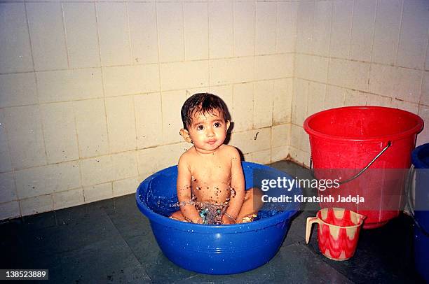small two years old boy bathing - 90 years stockfoto's en -beelden