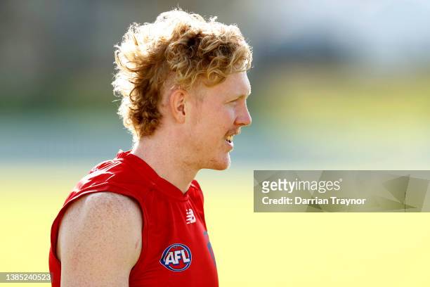 Clayton Oliver of the Demons looks on during a Melbourne Demons AFL training session at Port Melbourne Football Club on March 15, 2022 in Melbourne,...