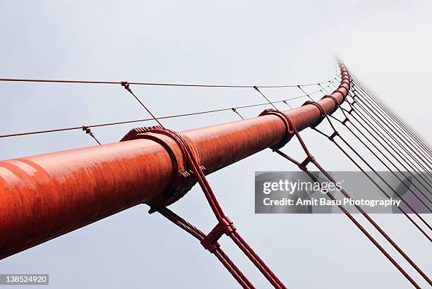 golden gate bridge in fog - golden gate stock-fotos und bilder