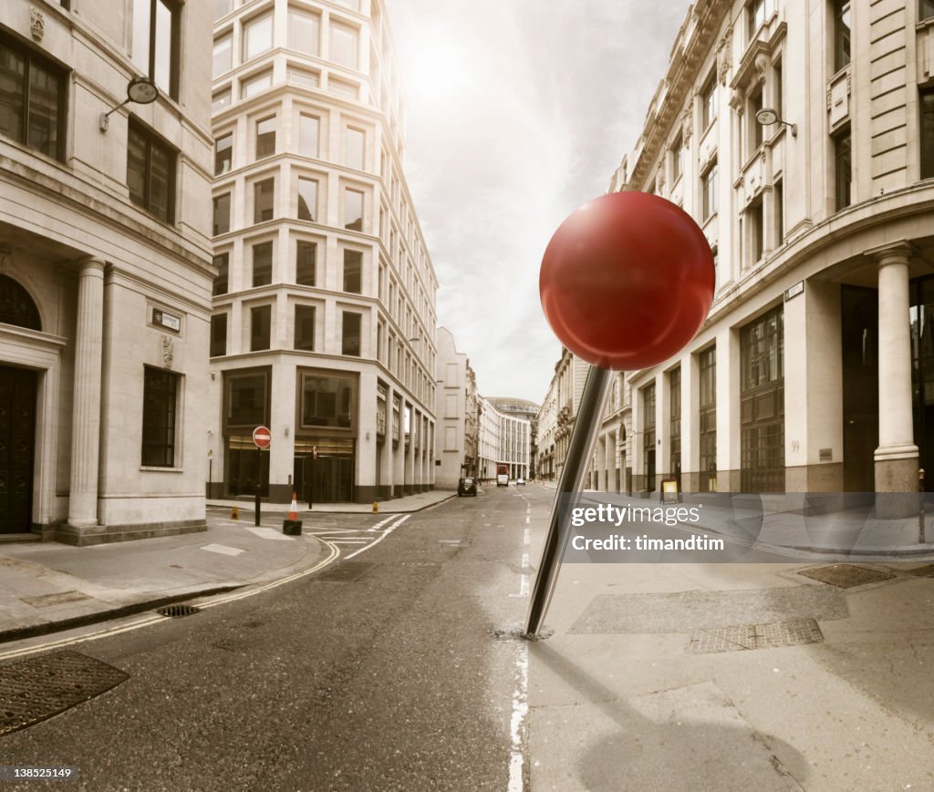 Drooped pin in the street on a sunny day