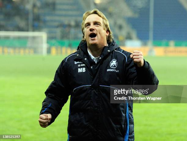 Head coach Mike Bueskens of Fuerth celebrates with the fans after winning the DFB Cup Quarter Final match between TSG 1899 Hoffenheim and SpVgg...