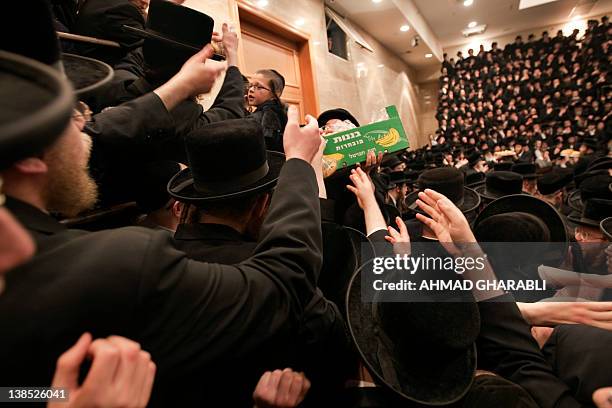 Orthodox Rabbiu An Ultra-Orthodox Jewish rabbi distributes fruits during a... News ...