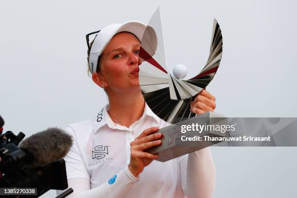 Nanna Koerstz Madsen of Denmark poses with the trophy on the 18th green after winning the final round of Honda LPGA Thailand at Siam Country Club...