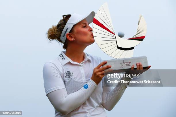 Nanna Koerstz Madsen of Denmark poses with the trophy on the 18th green after winning the final round of Honda LPGA Thailand at Siam Country Club...
