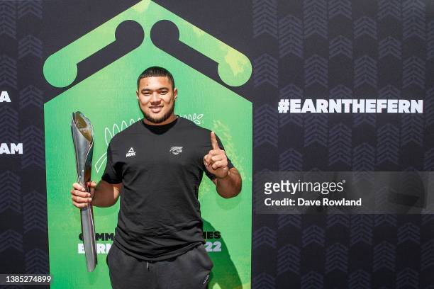 Weightlifter Koale Junior Tasi Taala with the Queen's Baton at a Commonwealth Games Athlete Selection Announcement during the Queen's Baton Relay on...