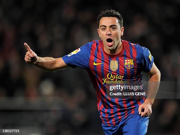 Barcelona's midfielder Xavi Hernandez celebrates after scoring during the Spanish Cup second leg semi-final football match FC Barcelona vs Valencia...