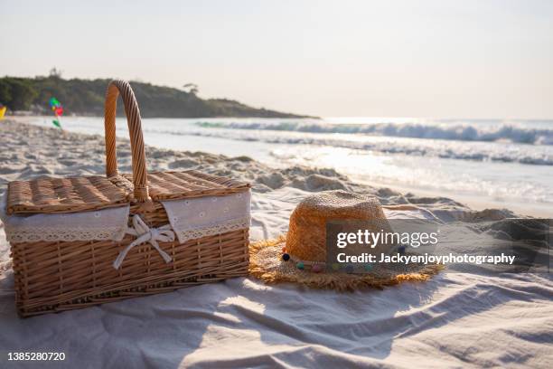 beach bag with accessories on the beach - strandväska bildbanksfoton och bilder