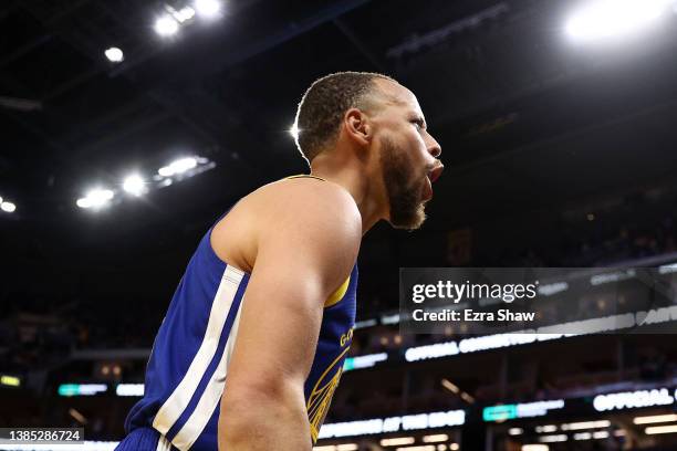 Stephen Curry of the Golden State Warriors reacts after making a basket and being fouled by the Washington Wizards in the fourth quarter at Chase...