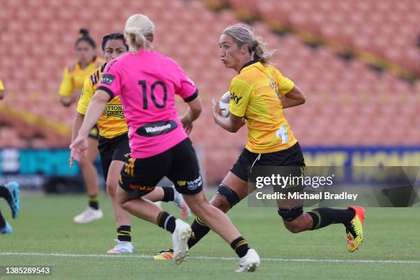 Sarah Hirini of Hurricanes Poua looks to step the tackle during the round three Super Rugby Aupiki match between Chiefs Manawa and Hurricanes at FMG...