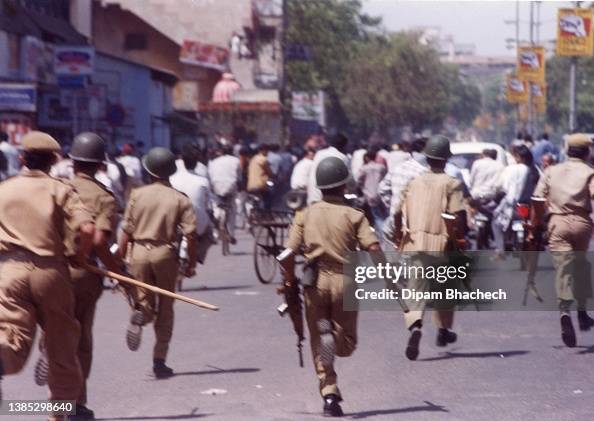 Godhra Riots Gujrat Police stopping stone pelters at Dariyapur in Ahmedabad Gujarat India ...