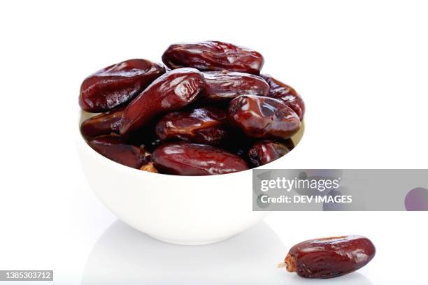 fresh dates in a white bowl - dates fruit stock pictures, royalty-free photos & images