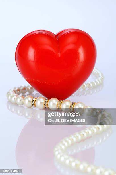 pearl necklace - heart bracelet stock pictures, royalty-free photos & images