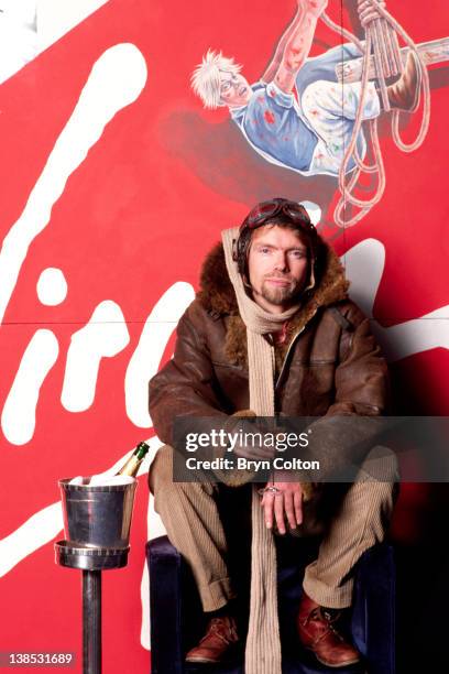 Richard Branson, co-founder of Virgin Atlantic Airways, poses in leather flying jacket and helmet during a news conference to launch the airline at...