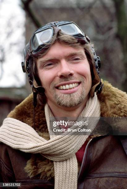 Richard Branson, co-founder of Virgin Atlantic Airways, poses in leather flying jacket and helmet during a news conference to launch the airline at...