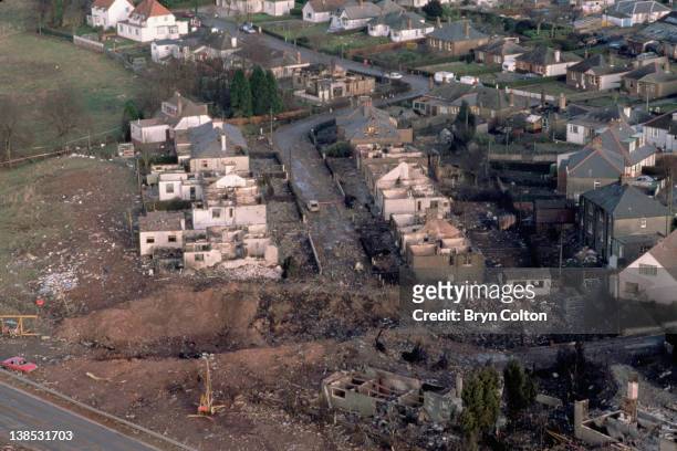 Aircraft debris and destroyed houses in Sherwood Crescent, Lockerbie are seen from the air following the midair bombing of Pan Am flight 103,...