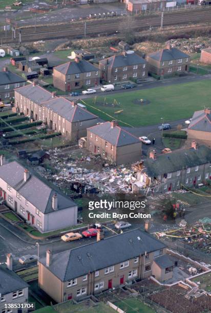 Aircraft debris and destroyed houses in the village of Lockerbie are seen from the air following the midair bombing of Pan Am flight 103, 'Clipper...