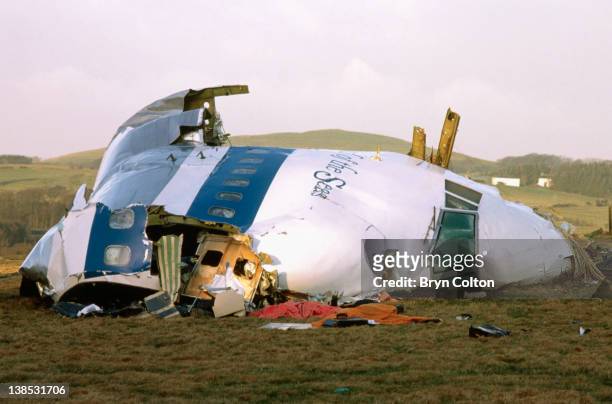 Debris surrounds the cockpit section of 'Clipper Maid of the Seas, Pan Ams flight 103 as it lay on the ground following a midair explosion over the...