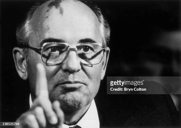 Mikhail Gorbachev, Russian President, gestures as he speaks during his new conference following the weekend summit with U.S. President Ronald Reagan...