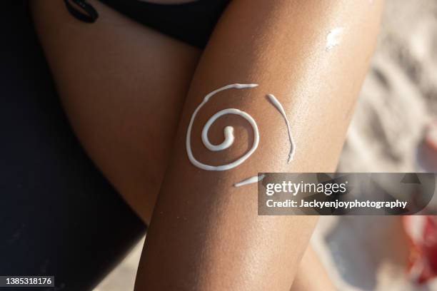 sun protection - tanned body stock pictures, royalty-free photos & images