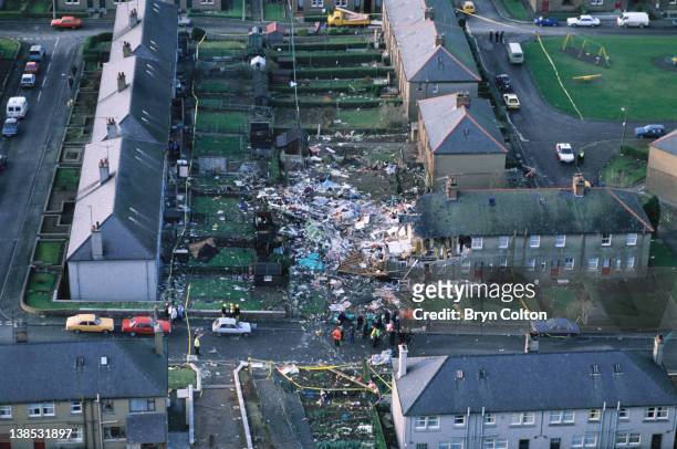 Aircraft debris and destroyed houses in the village of Lockerbie are seen from the air following the midair bombing of Pan Am flight 103, 'Clipper...
