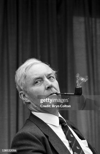 Tony Benn, Labour Party MP, smokes his pipe as he listens during a conference at the Marina Leisure Centre in Great Yarmouth, U.K, in May 1998. Benn,...