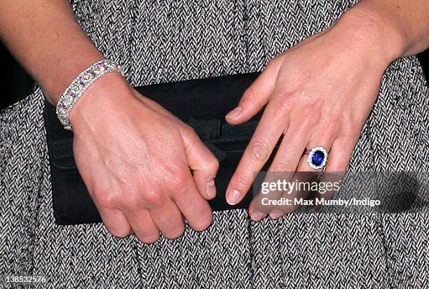 Catherine, Duchess of Cambridge's clutch bag, bracelet and engagement ring seen as she attends the 'Lucian Freud Portraits' exhibition at the...